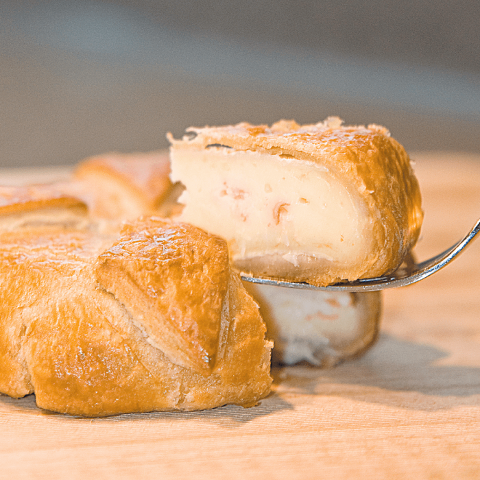 A delicious King Crab and Brie Pastry, golden brown and freshly baked.
