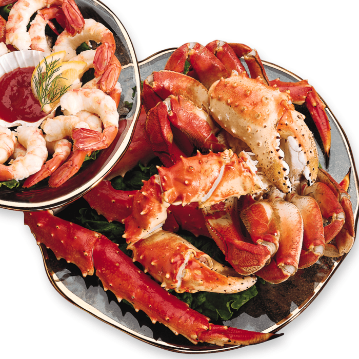 Assortment of various types of fresh shellfish displayed on ice.