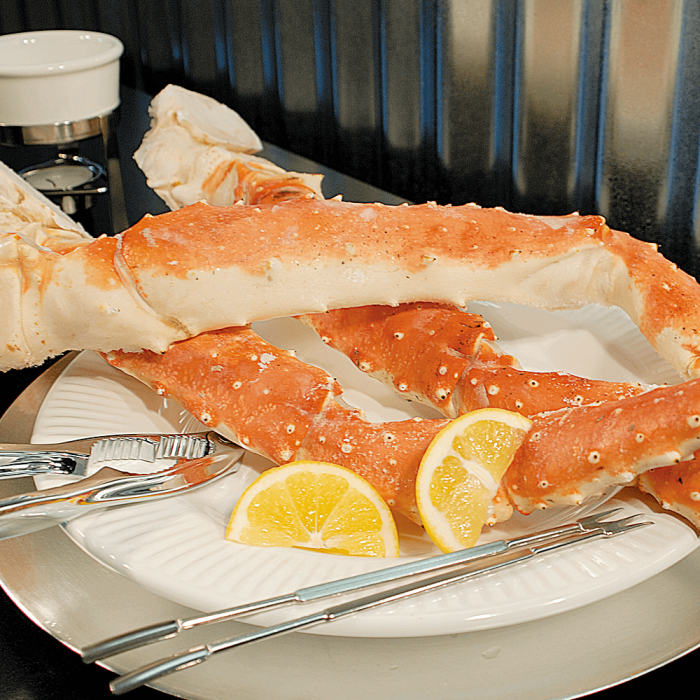 A display of the Super Jumbo King Crab Special, showcasing large, succulent crab legs with a rich, vibrant color indicating freshness and high quality.