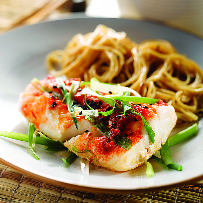 A large combo meal featuring cod whitefish served with side dishes.