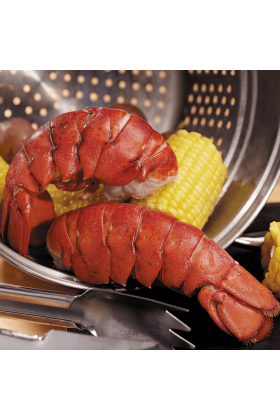 Two fresh Maine lobster tails on a white background.